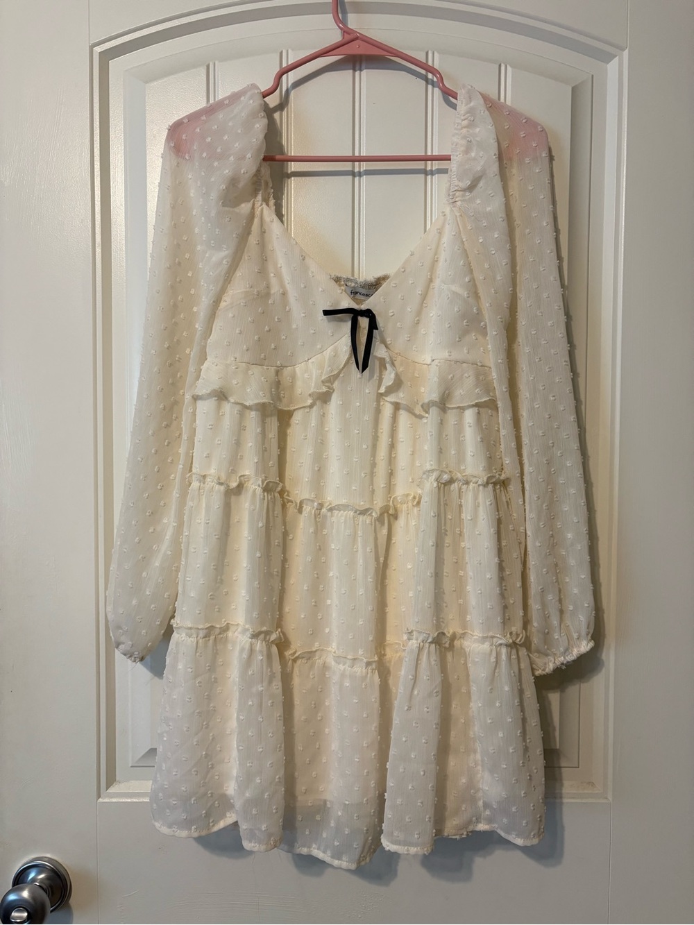 Francesca's Ivory Swiss Dot Babydoll Dress with Black Bow